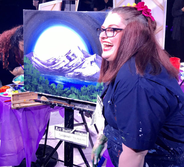 art battle tournament painter with her painting