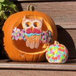 painted pumpkins on a porch